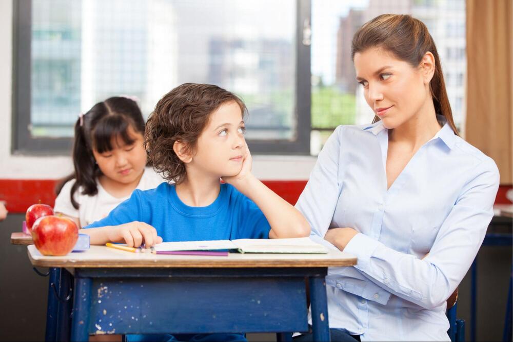 Image of teacher teaching a child 