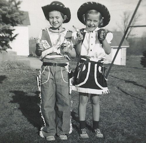 Image of a two kids dressed as cowboy and cowgirl for Halloween 