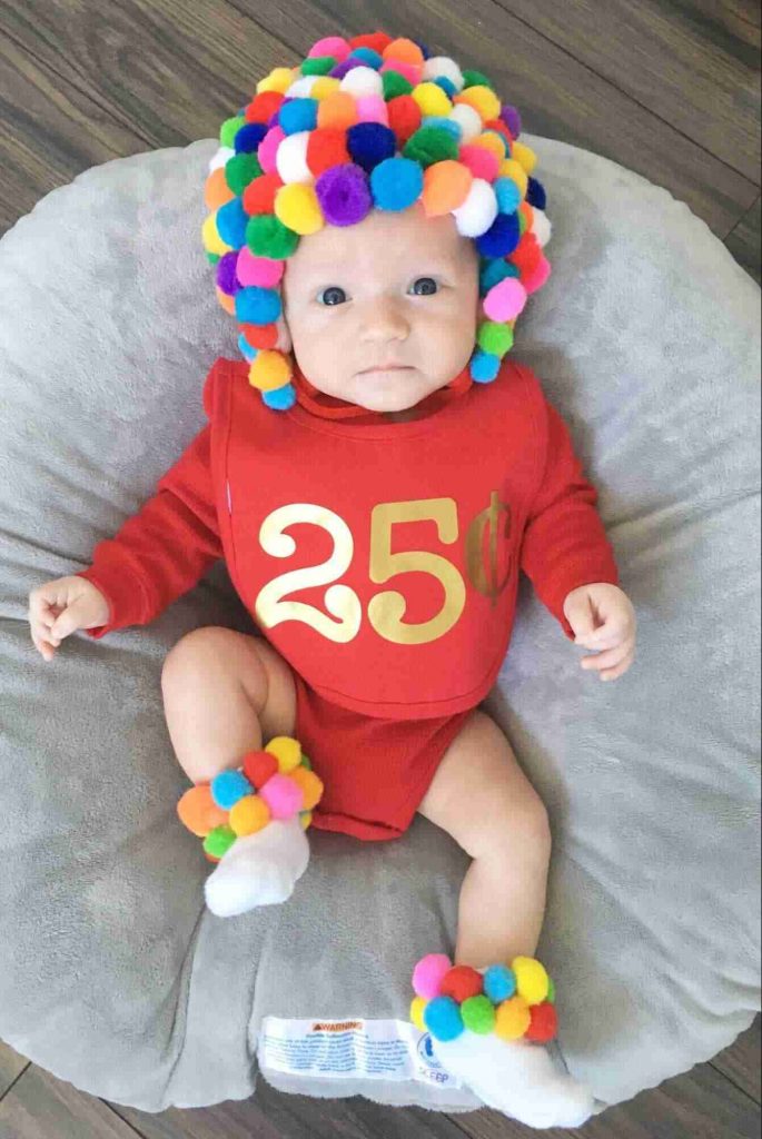 Image of a toddler dressed as a gumball machine for Halloween
