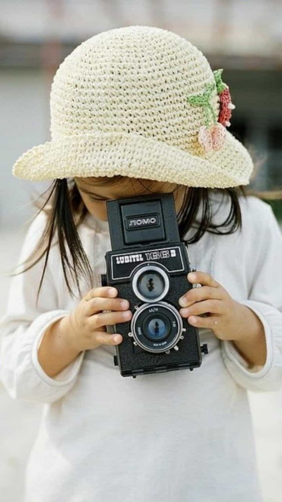 An image of a kid taking pictures