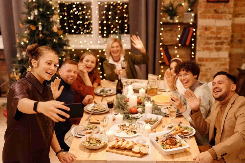 An image of a family clicking pictures on Christmas 