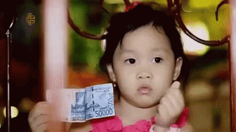 A girl with money GIF