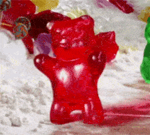 A GIF of a gummy bear walking 