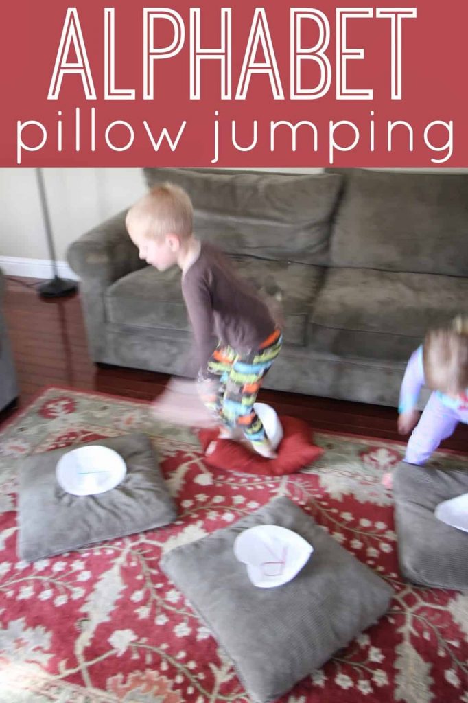 Kid playing alphabet pillow jumping - activities for preschoolers 