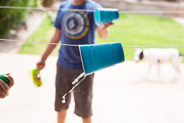 Image of cup on a string for a water cup race a fun outdoor game for kids
