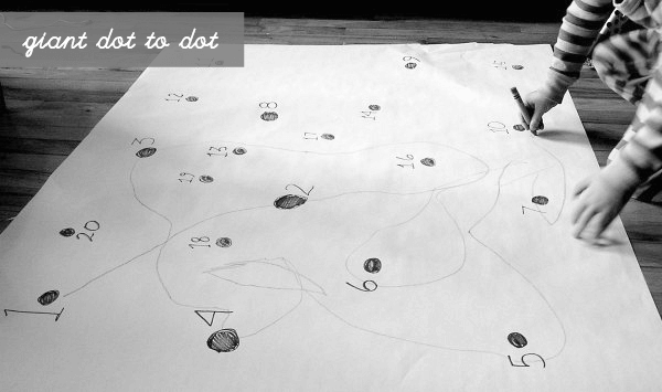An image of a fun indoor play for kids - connecting dots to dots on a giant paper 