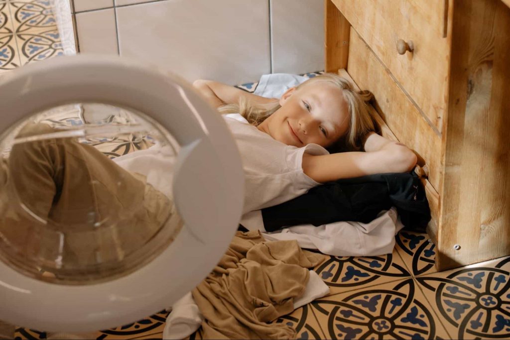 Image of a kid smiling after doing some chores