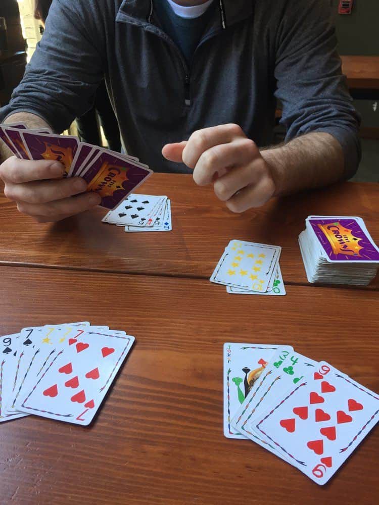 Image of man playing card game