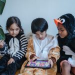 3-children-playing-tablet-game-would-you-rather-questions