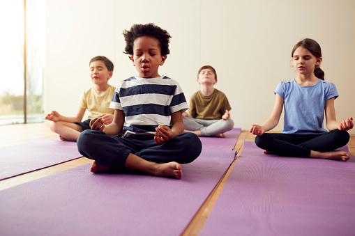 Children meditating on yoga mats kids meditation