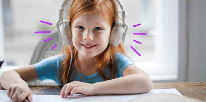 Featured image auditory learning little girl listening on headphones