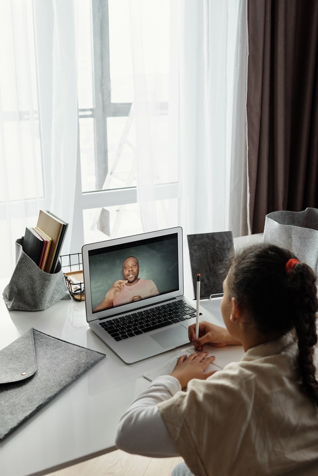 Little girl taking online classes teaching tools Little girl taking online classes teaching tools
