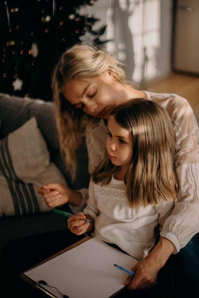 Mother talking to daughter explaining brain teasers for kids