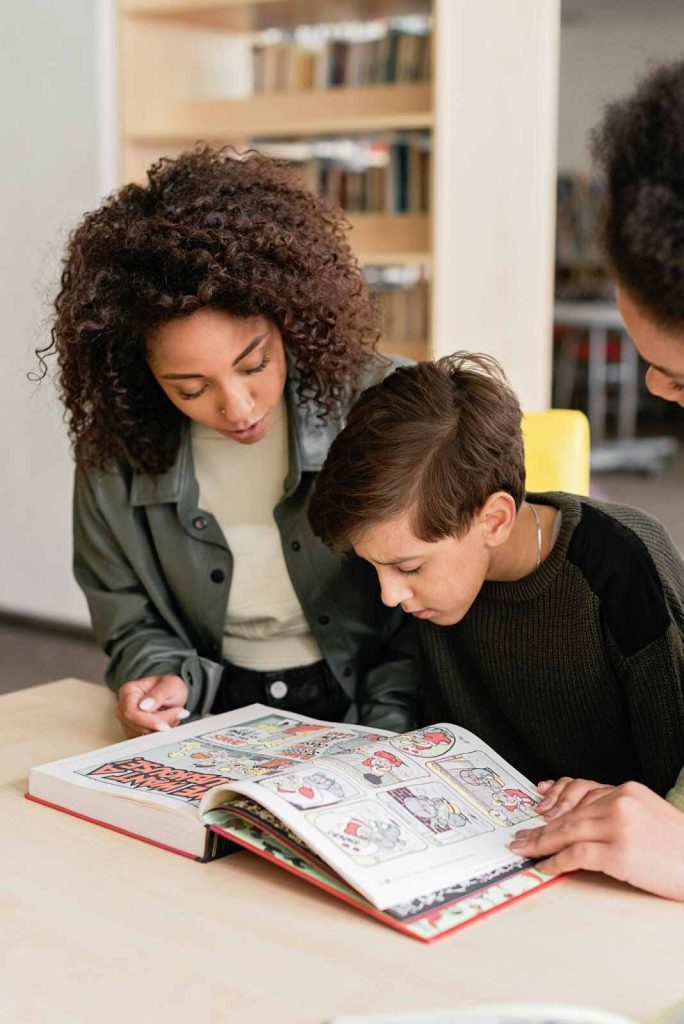 Teacher showing student text in book leveled readers 3 Teacher showing student text in book leveled readers 3