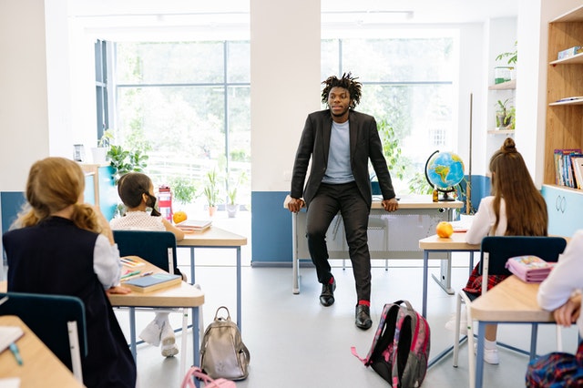 Teacher talking to his class Auditory Learning