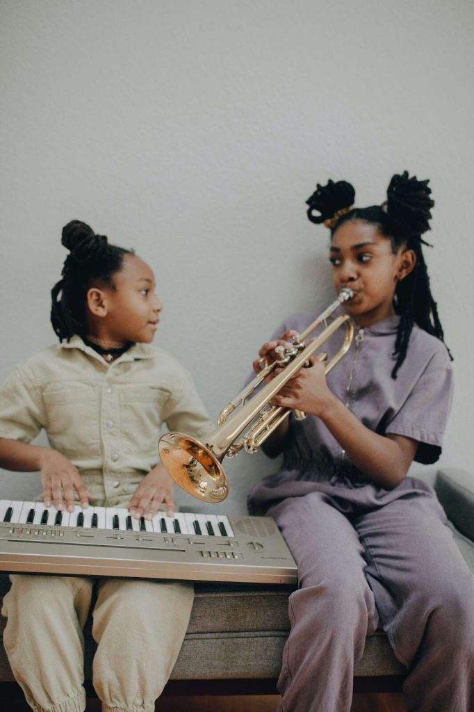 Young girls playing instrument auditory learning