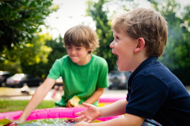 boys playing games and eating and laughing compassionate vs. empathetic