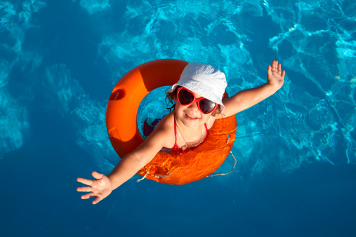 Image of a kid enjoying pool summer activities for kids