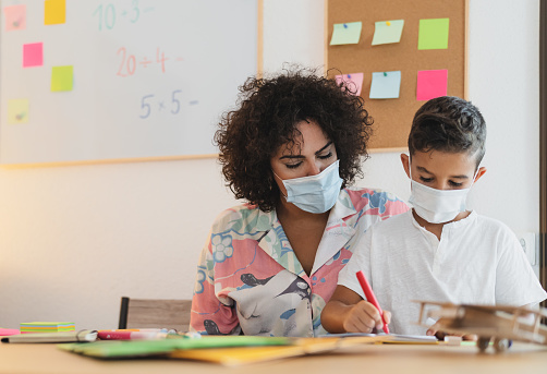 Image of teacher and student in class