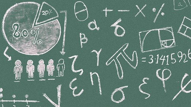 Blackboard with math symbols and graphs math symbols Blackboard with math symbols and graphs math symbols