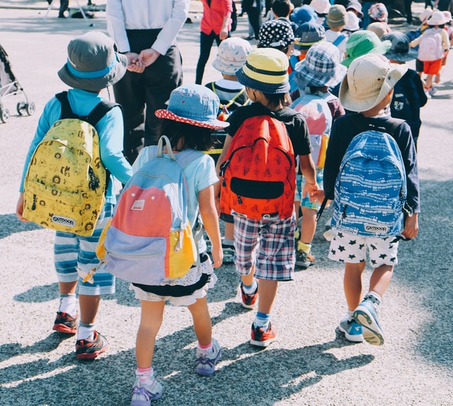 Children walking together on First Day of School Children walking together on First Day of School