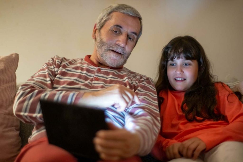 Grandparent reading ebook with grandchildren free ebooks