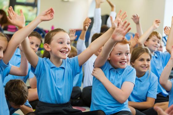 Children celebrating in class ice breaker questions for kids