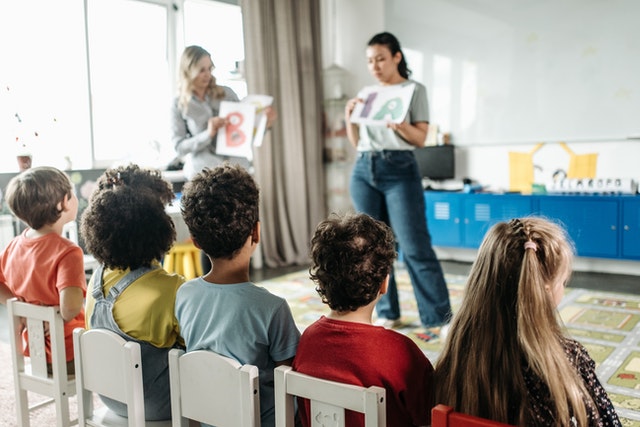 Children sitting on white chairs blooms taxonomy Children sitting on white chairs bloom's taxonomy