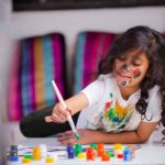 Girl painting picture Spring activities for preschoolers