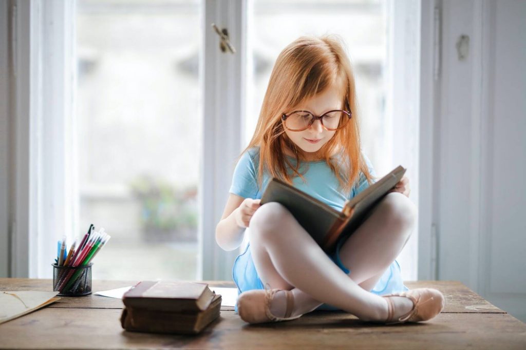 Girl reading book zones of learning