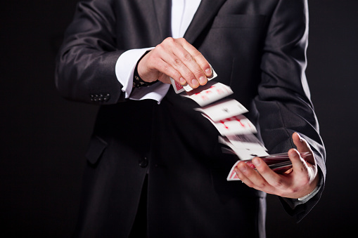 Man shuffling cards magic tricks for kids Man shuffling cards magic tricks for kids