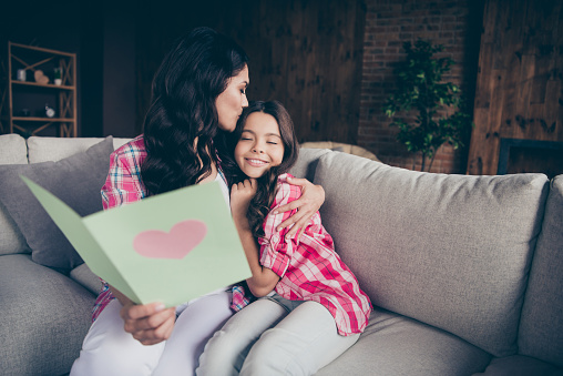 Mother and daughter reading together mom poems