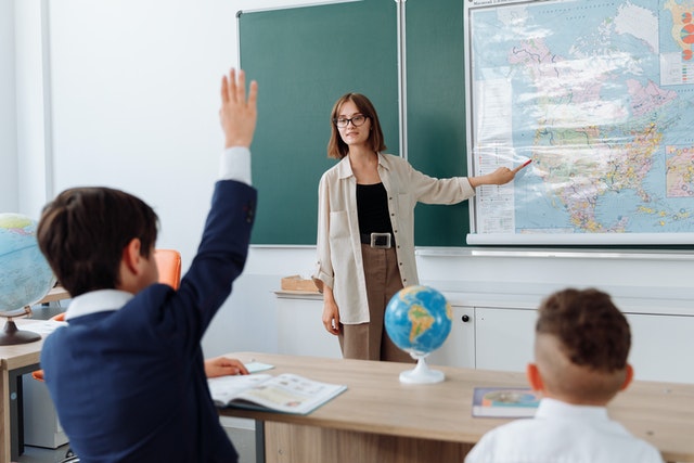 Teacher discussing her lesson about geography blooms taxonomy Teacher discussing her lesson about geography bloom's taxonomy