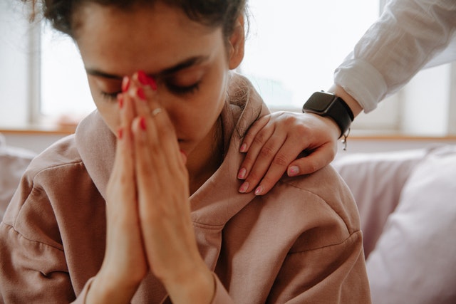 Woman comforting friend restorative practices in the classroom