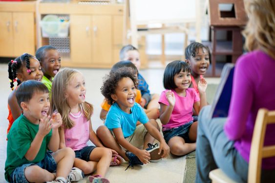 children smiling in class with teacher growth mindset for kids