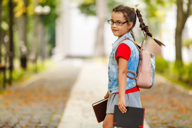 Child going back to school. Start of new school year after summer vacation. 