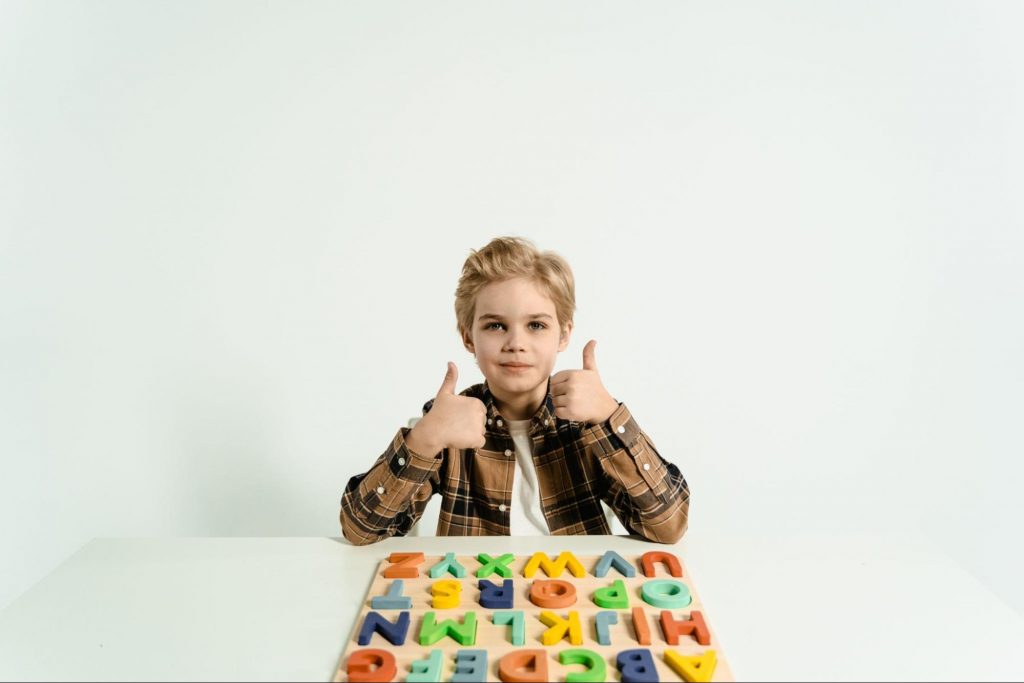 Image of a kid playing spelling games