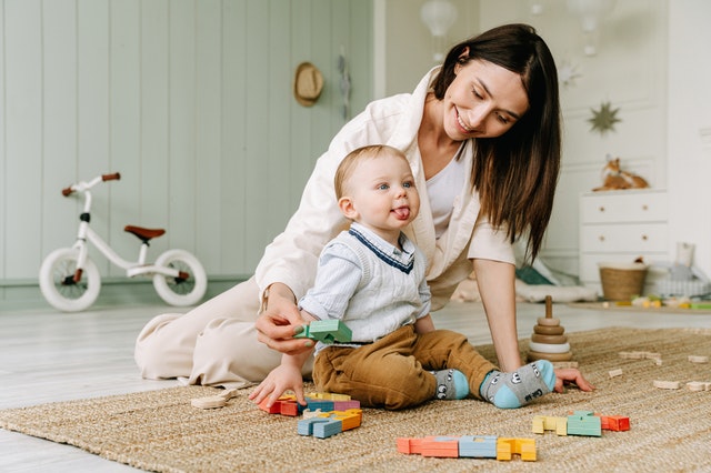 Image of a mother and son playing with blocks
