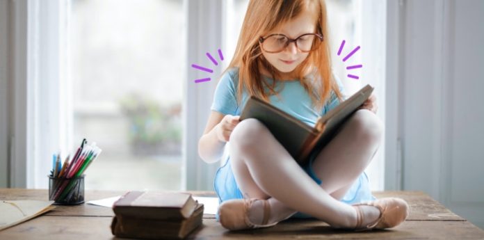 Image of a kid reading a nonfiction book for kids