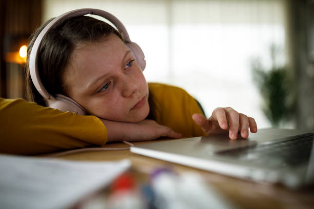 Bored school girl having online class