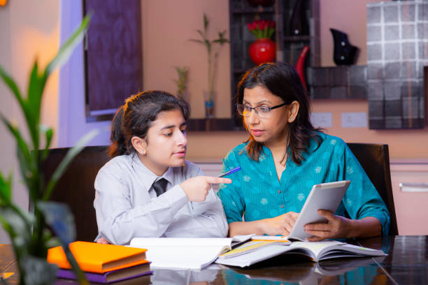 Mother and daughter studying reading websites for kids Mother and daughter studying reading websites for kids
