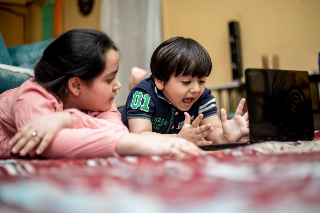 Children Playing Games on Laptop