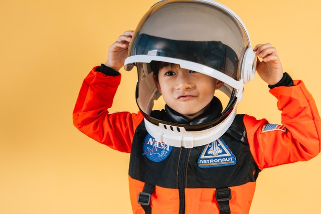 Kid Wearing Astroonaut Helmet and Suit