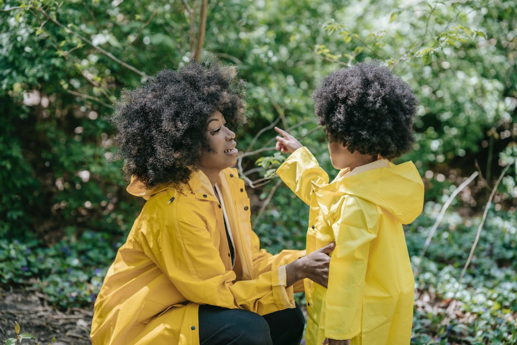 afrowomenandchildinforest Mother and daughter on a nature walk hiking in woods