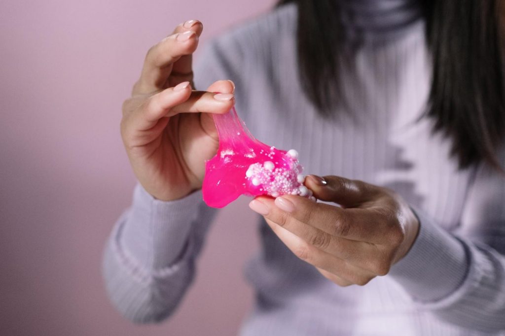 Women close hand shot making something like jelly or cake