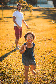 Father and daughter playing in the park