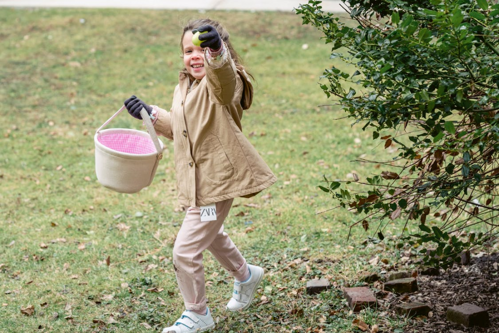 puttogetherascavengerhuntinyourhouseorbackyard Small girl running with fruit in hand