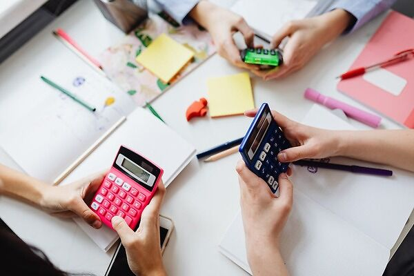 Kids using a calculator to solve math problems