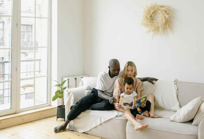 Family with child relaxing on a couch