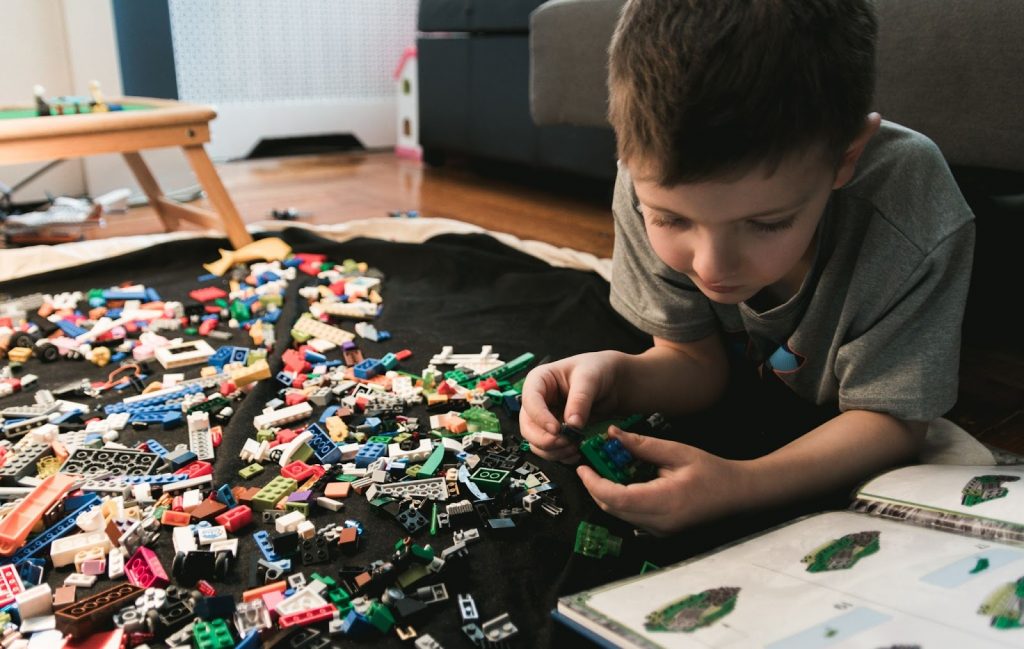 Young boy playing with lego blocks